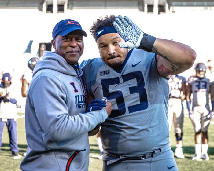 Kendrick Green (53) going through Senior Day celebration as a fourth-year junior with Illinois head coach Lovie Smith before the 35-21 loss to Iowa on Dec. 5, 2020.